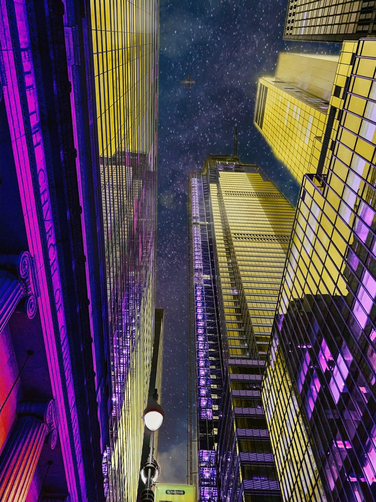 Looking up between gold and violet skyscrapers into a starry night sky